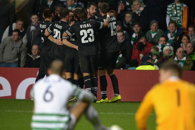 Mirko Vucinic of Juventus celebrates with his team-mates after scoring his team's third goal against Celtic