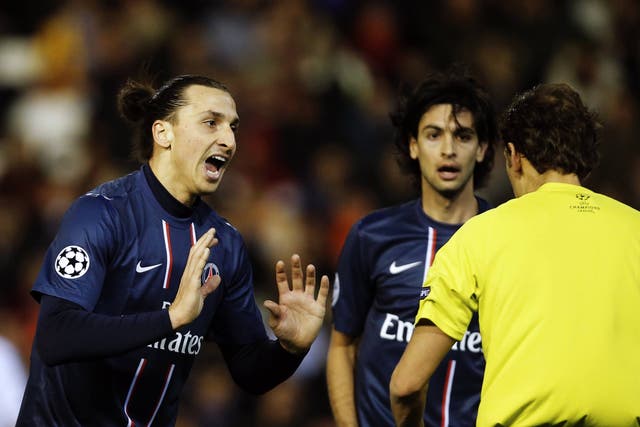 PSG striker Zlatan Ibrahimovic protests his innocence after being sent off against Valencia