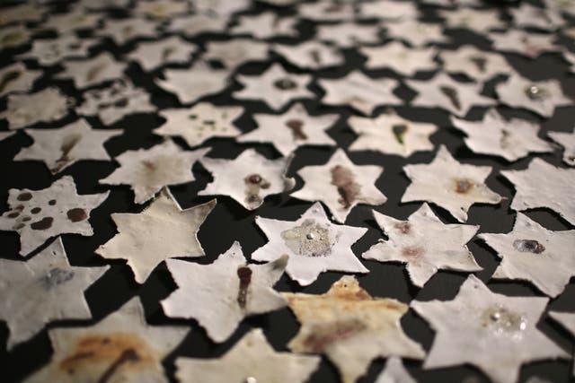 A detail from an installation by Ceramic artist Chava Rosenzweig of ceramic stars representing how the Holocaust shaped people's lives to mark Holocaust Memorial Day