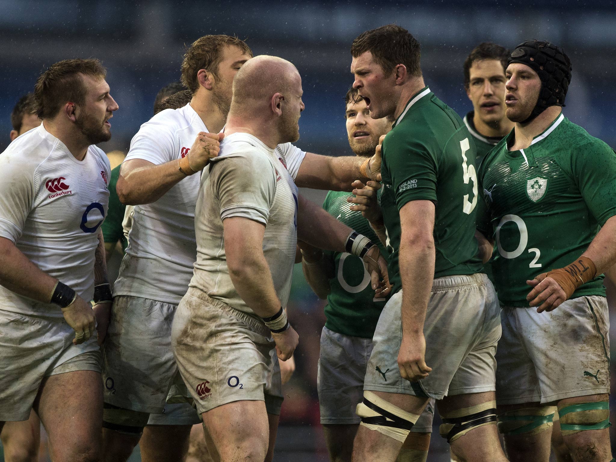 England's prop Dan Cole goes head to head with Ireland's lock Donnacha Ryan (2nd R) after the incident involving Cian Healy