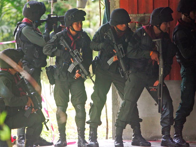 Thai police during the attack on the base yesterday