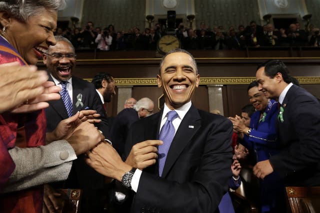 President Barack Obama is greeted before his State of the Union address