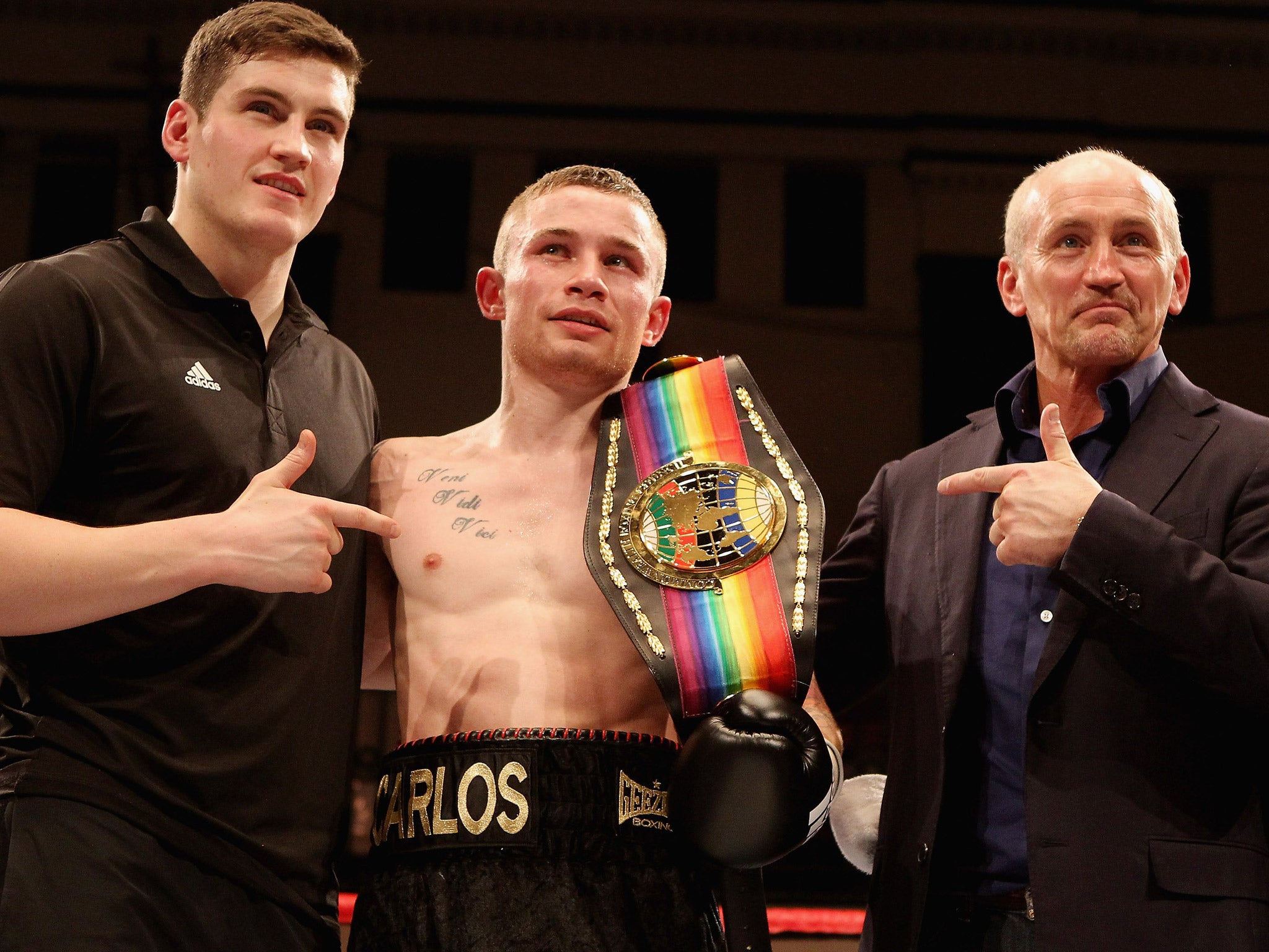 Carl Frampton with manager Barry McGuigan and trainer Shane McGuigan