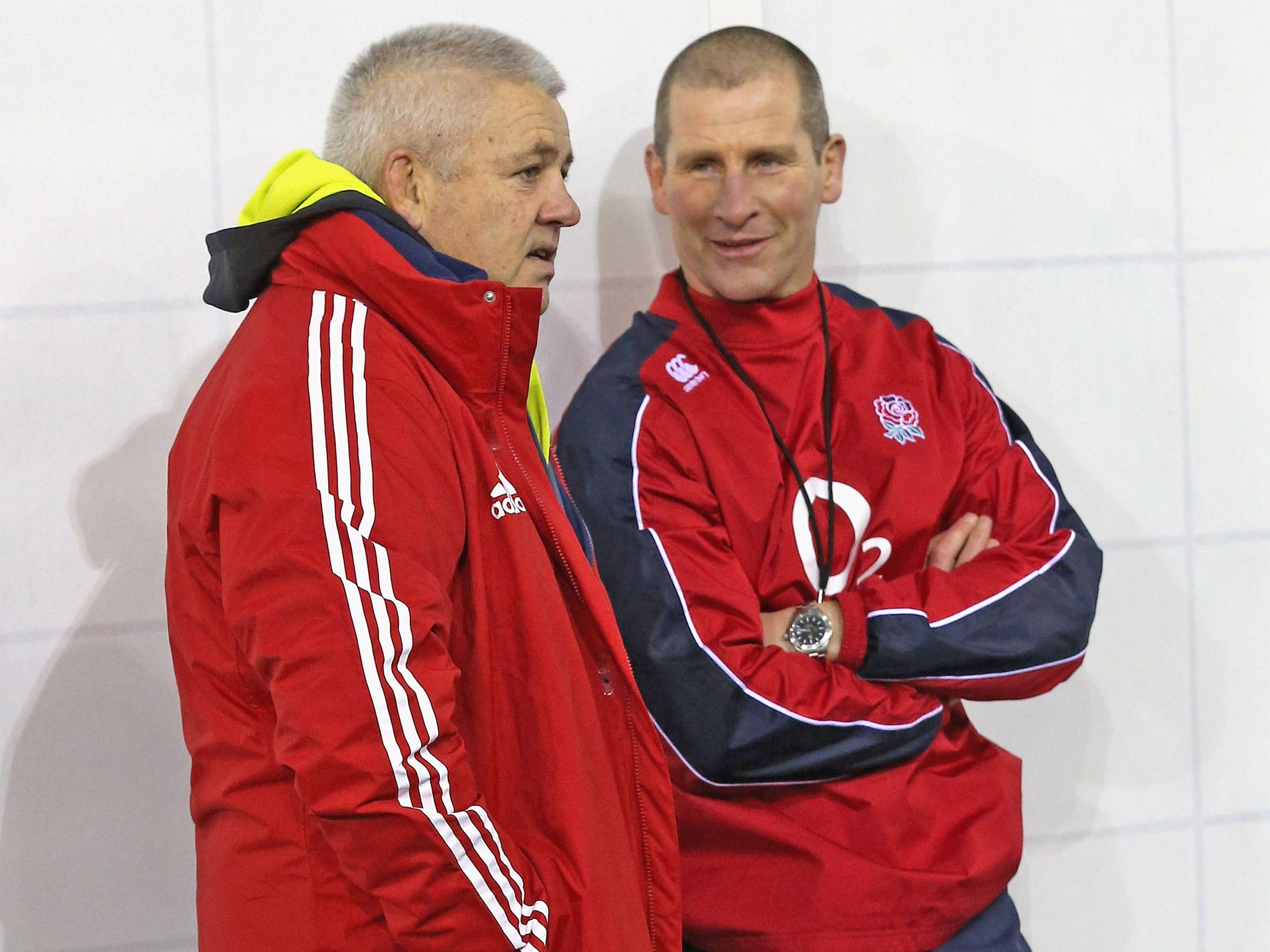 Warren Gatland chats to England coach Stuart Lancaster yesterday