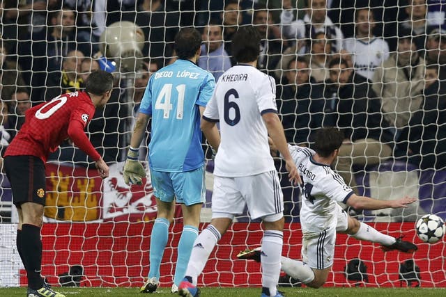 Robin Van Persie can only watch in vain as Xabi Alonso clears his mis-hit effort off the line last night