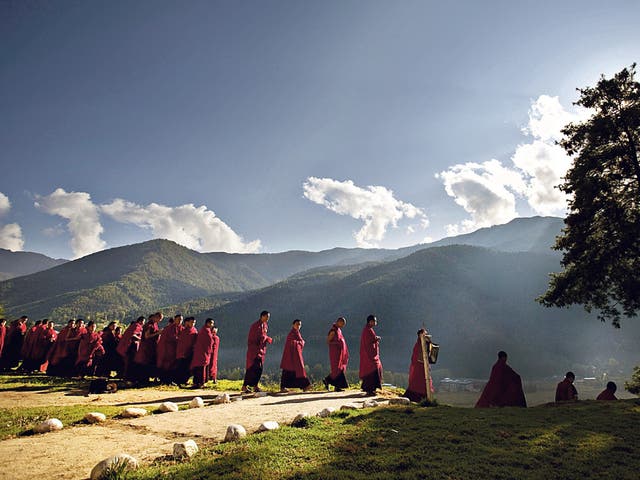 Walk on by: Buddhist monks on their way to a monastery in Bhutan