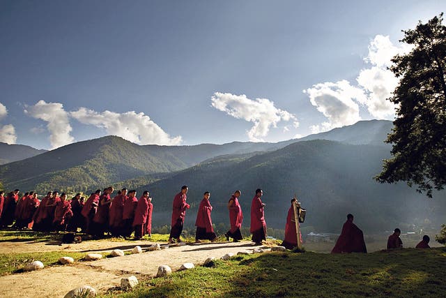 Walk on by: Buddhist monks on their way to a monastery in Bhutan