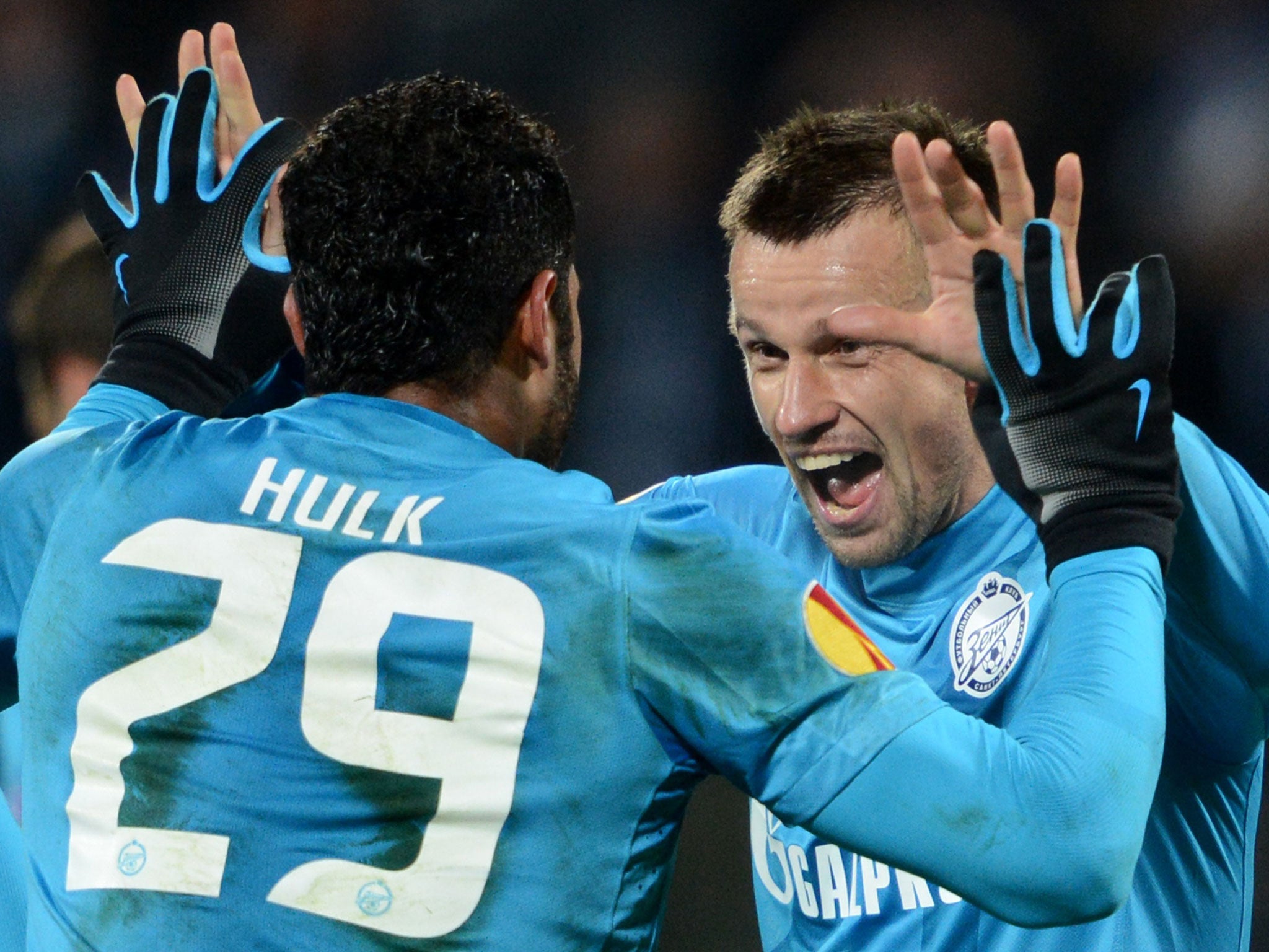 Hulk and Sergei Semak celebrate after scoring a goal