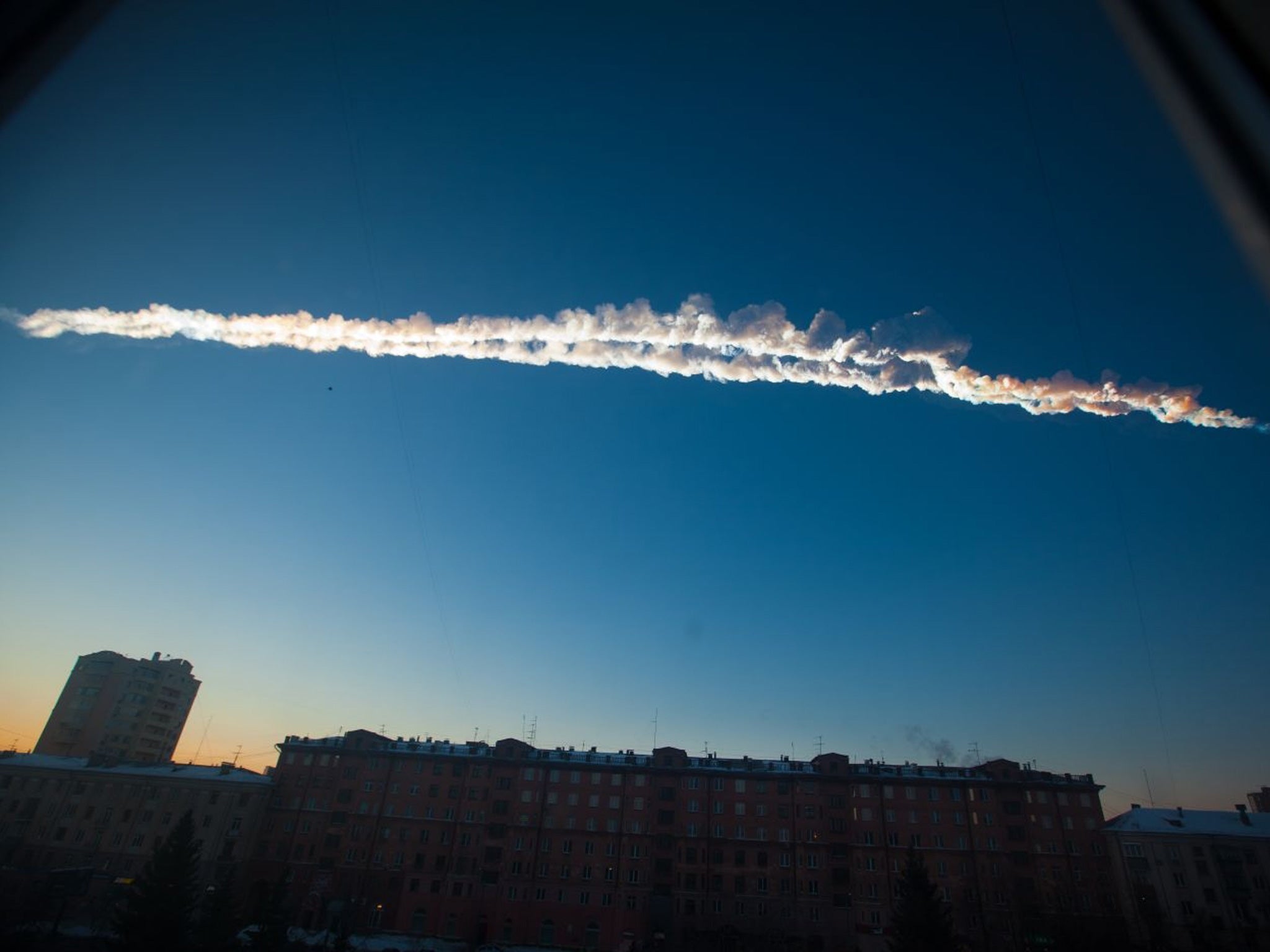 A meteorite trail is seen over Chelyabinsk, in 2013. Slooh's flagship observatory on Mount Teide in Spain's Canary Islands was iced over and unable to record live images of the 2000 EM26 asteroid almost a year later