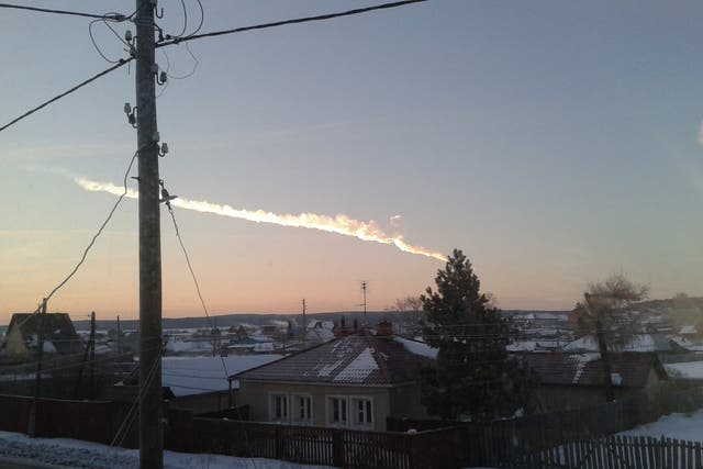 A meteor streaks across the sky of Russiaís Ural Mountains 