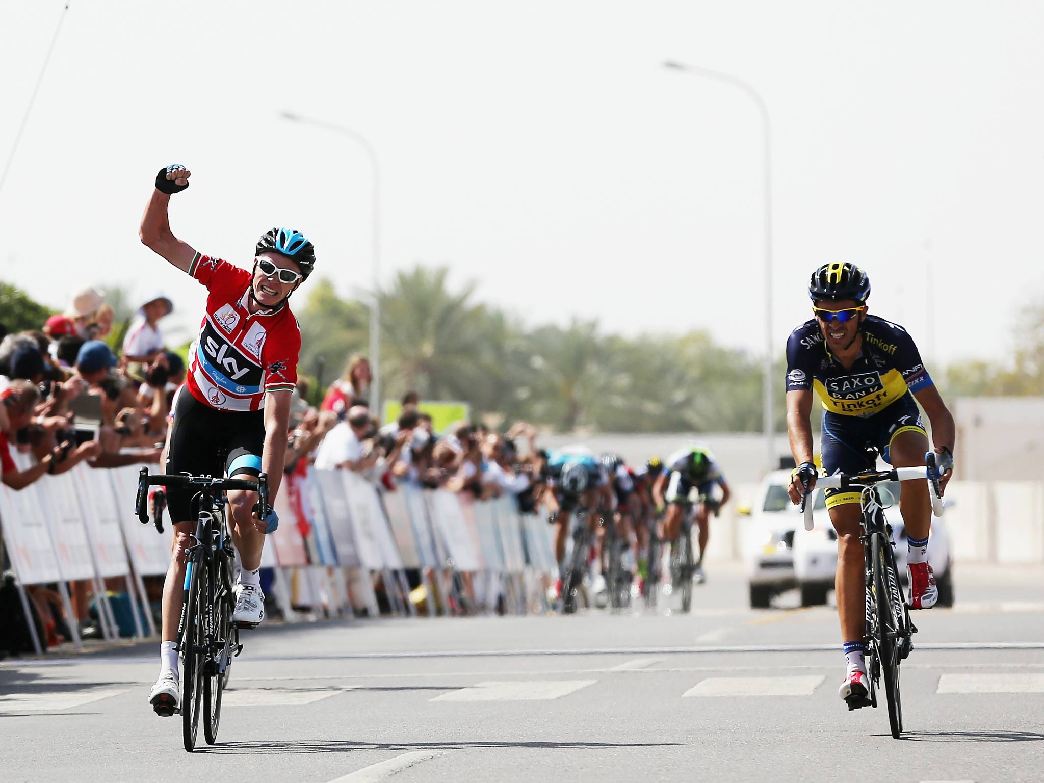 Chris Froome beats Alberto Contador to the line in on the Tour of Oman
