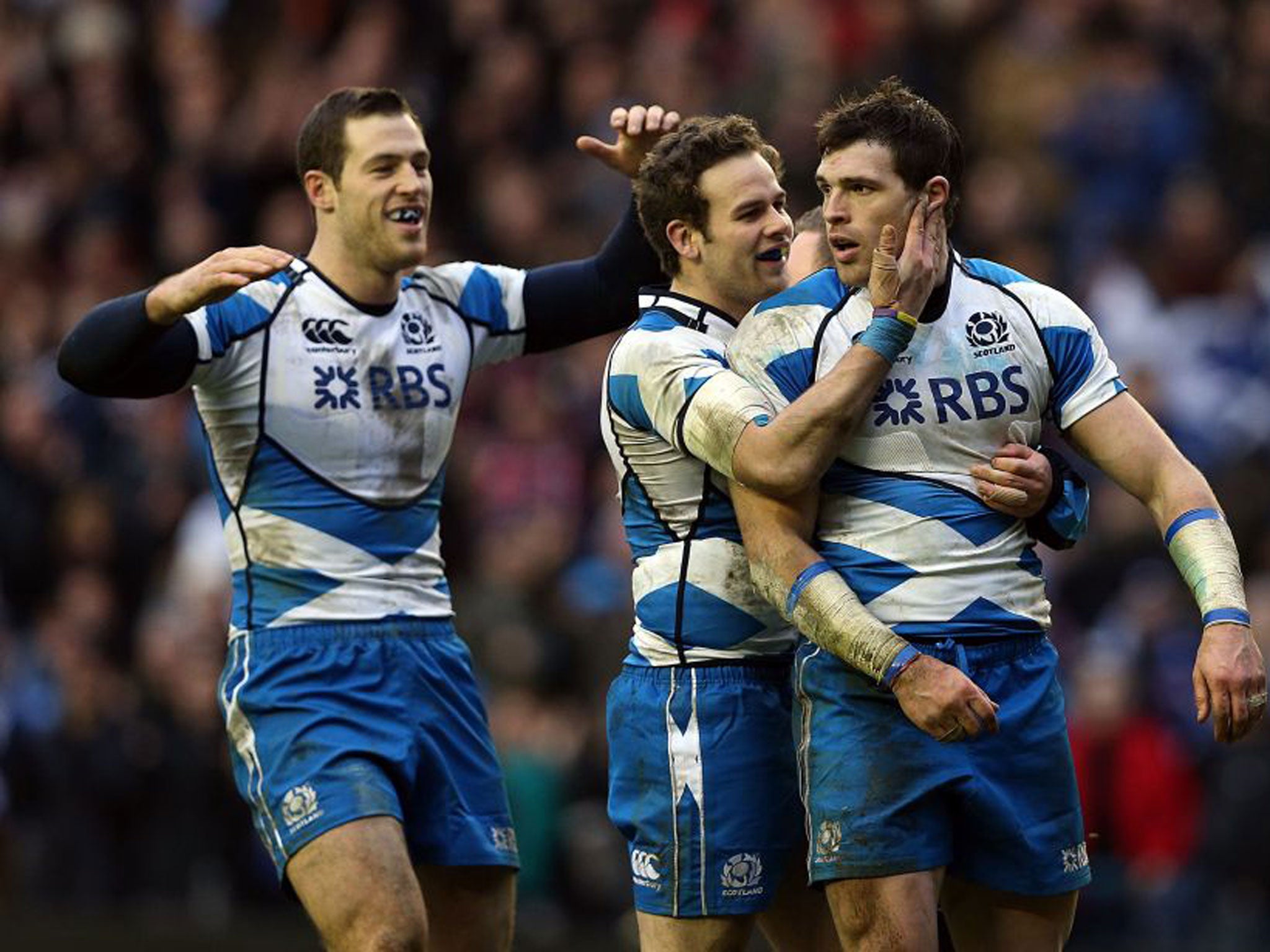 Sean Lamont (right) celebrates with Tim Visser (left) and Ruaridh Jackson during Scotland’s victory over Italy last weekend