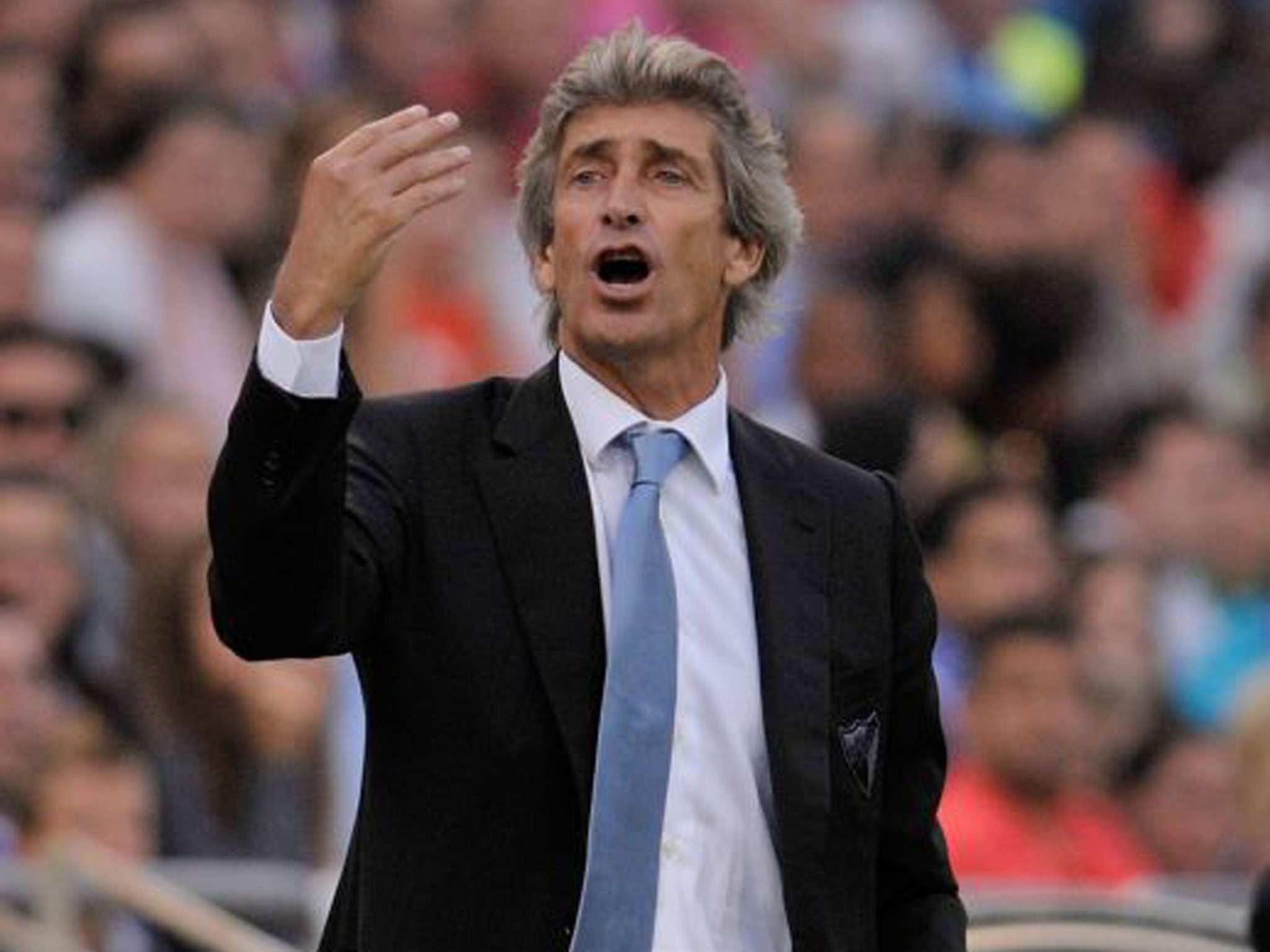 Malaga coach Manuel Pellegrini “would love to coach in England