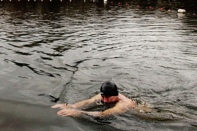 In the deep end: A bather at the Hampstead Heath men’s pond, north London