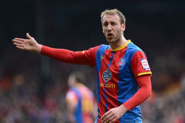 Glenn Murray of Crystal Palace remonstrates with the linesman