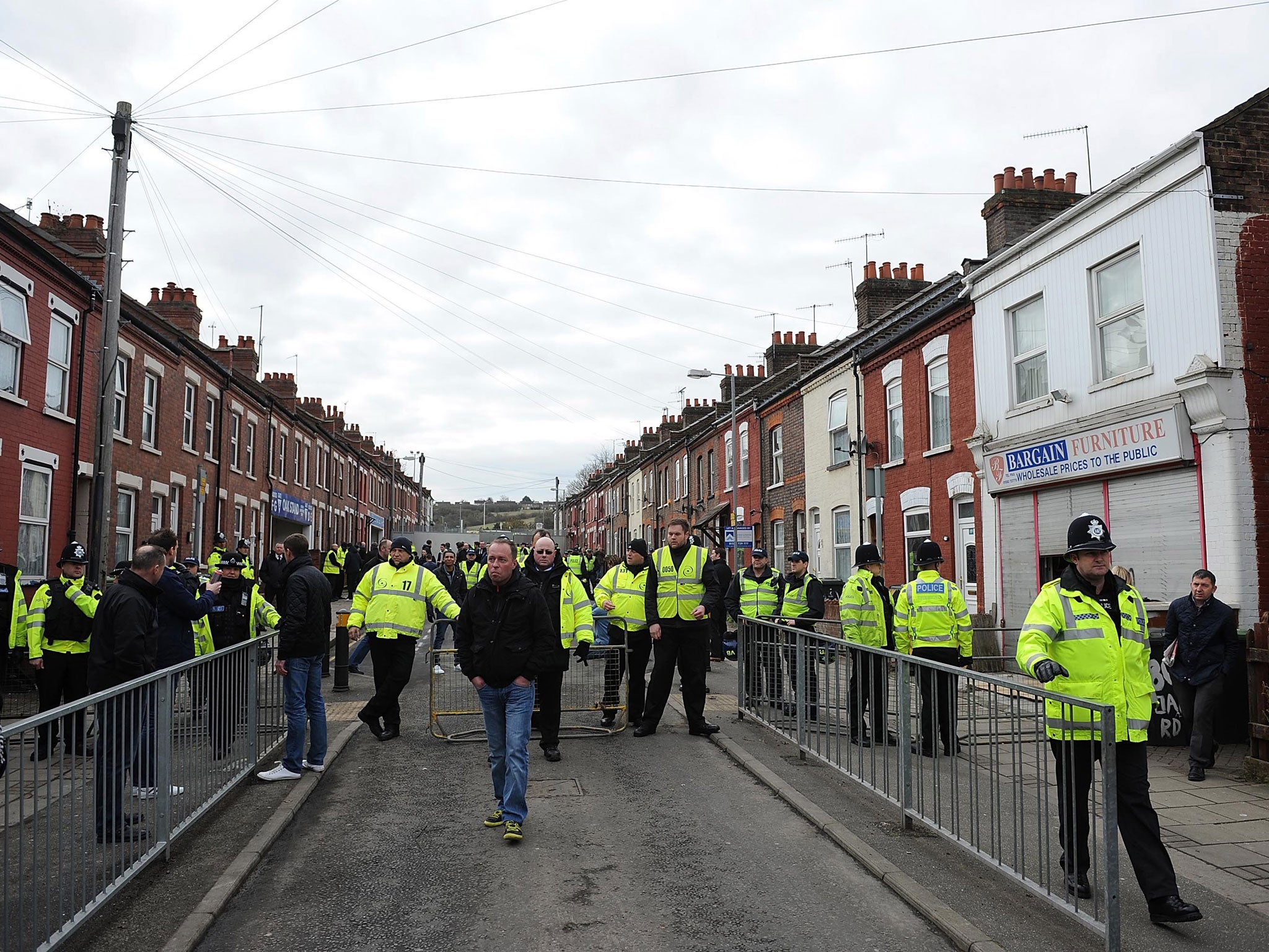 Ring of steel: Police and their dogs were out in force to keep Millwall fans under control