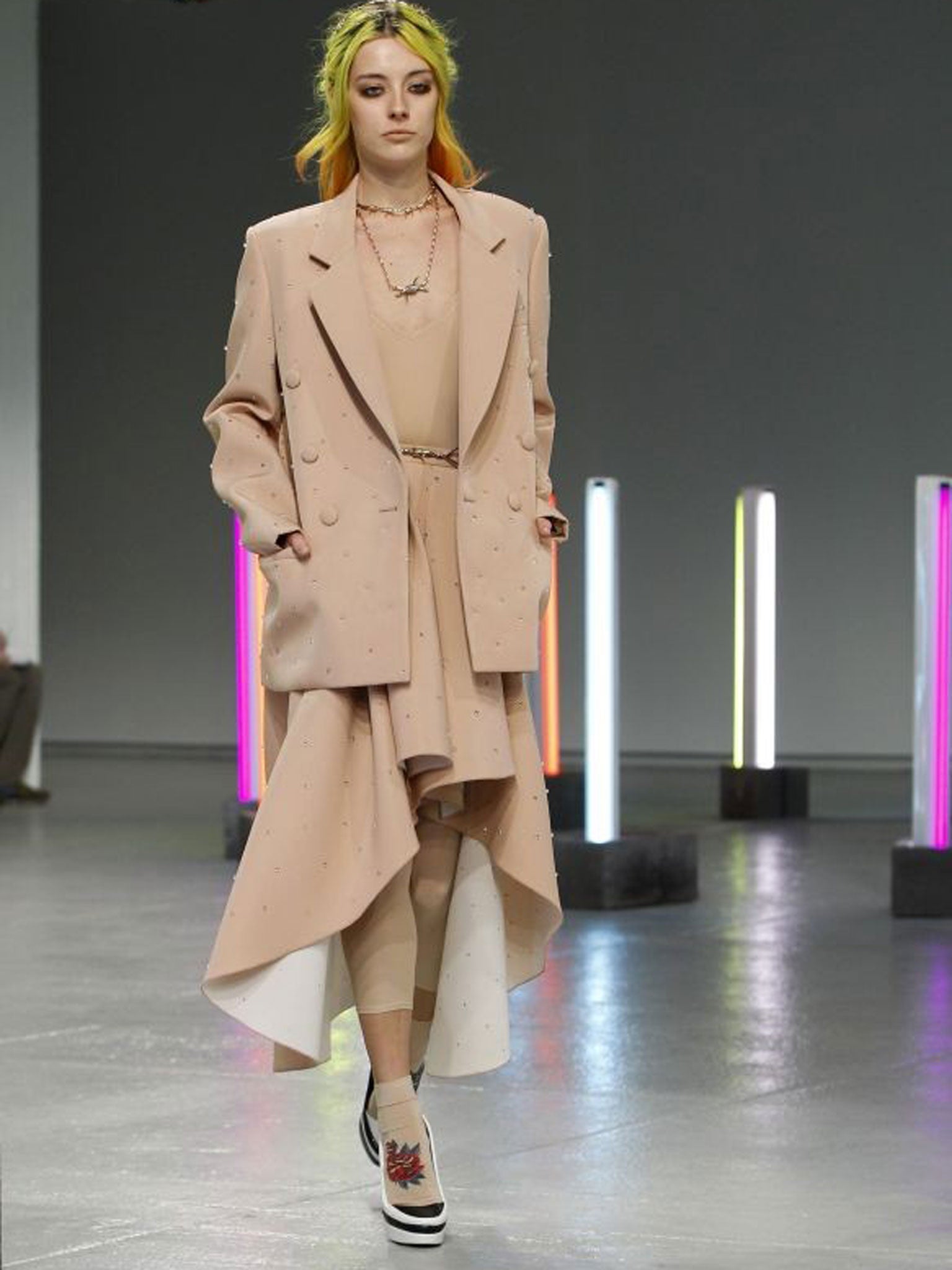 Rodarte: Rodarte's palette this season was black, white, grey and nude, which allowed the styled layering to do the 1980s talking. A splash of tie-dye on silk-satin floor-length dresses signified that we were back in the Mulleavy sisters' dream-like interpretation of their Santa Cruz childhood