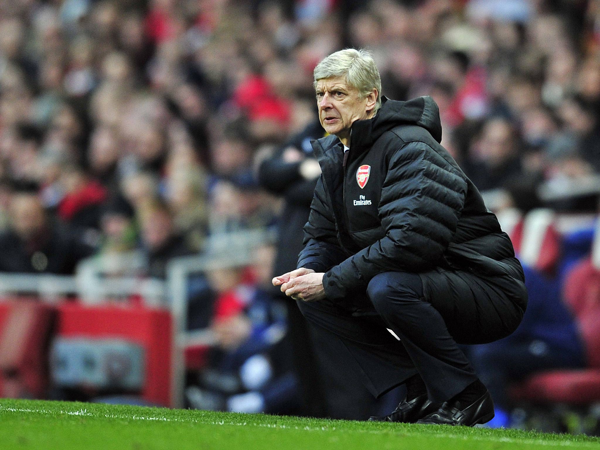Arsenal manager Arsene Wenger looks on