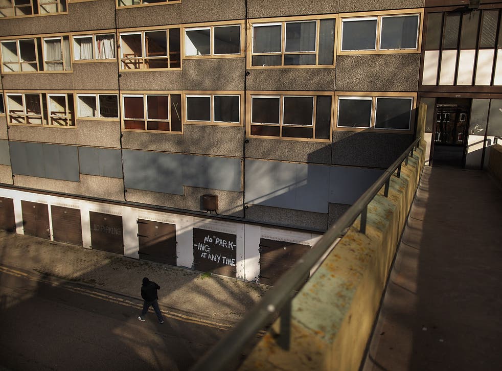 A man walks in late afternoon sunshine on the Heygate housing estate near Elephant and Castle on February 11, 2010 in London, England. 