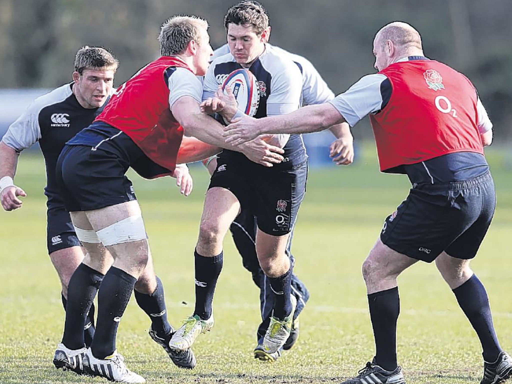 Alex Goode is tackled in training; the full-back says Premiership rugby has strengthened England