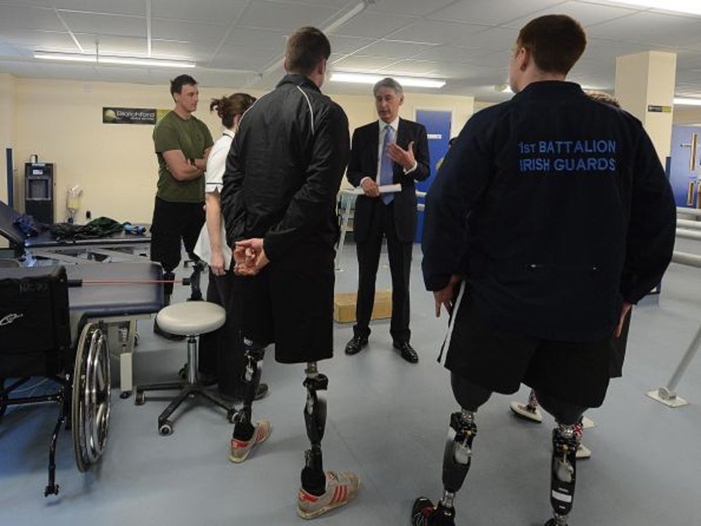 Philip Hammond (second right) during a visit to the Defence Medical Rehabilitation Centre, Headley Court