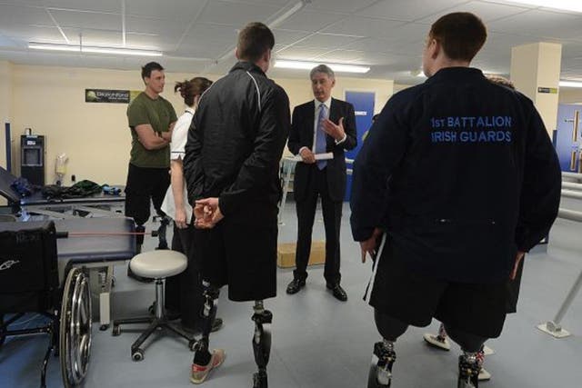Philip Hammond (second right) during a visit to the Defence Medical Rehabilitation Centre, Headley Court