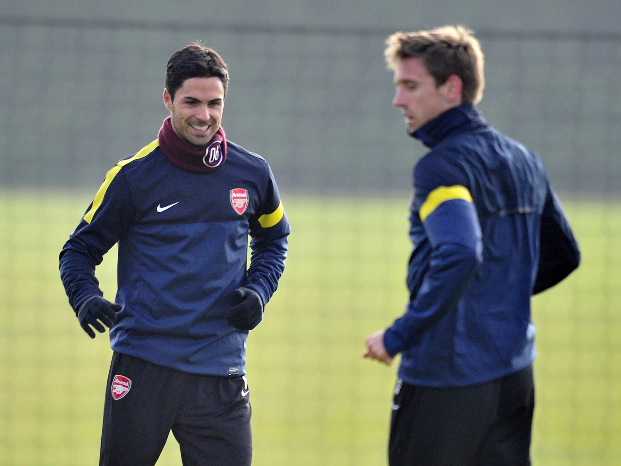 Arsenal's Spanish midfielder Mikel Arteta (left) trains alongside fellow Spaniard Nacho Monreal