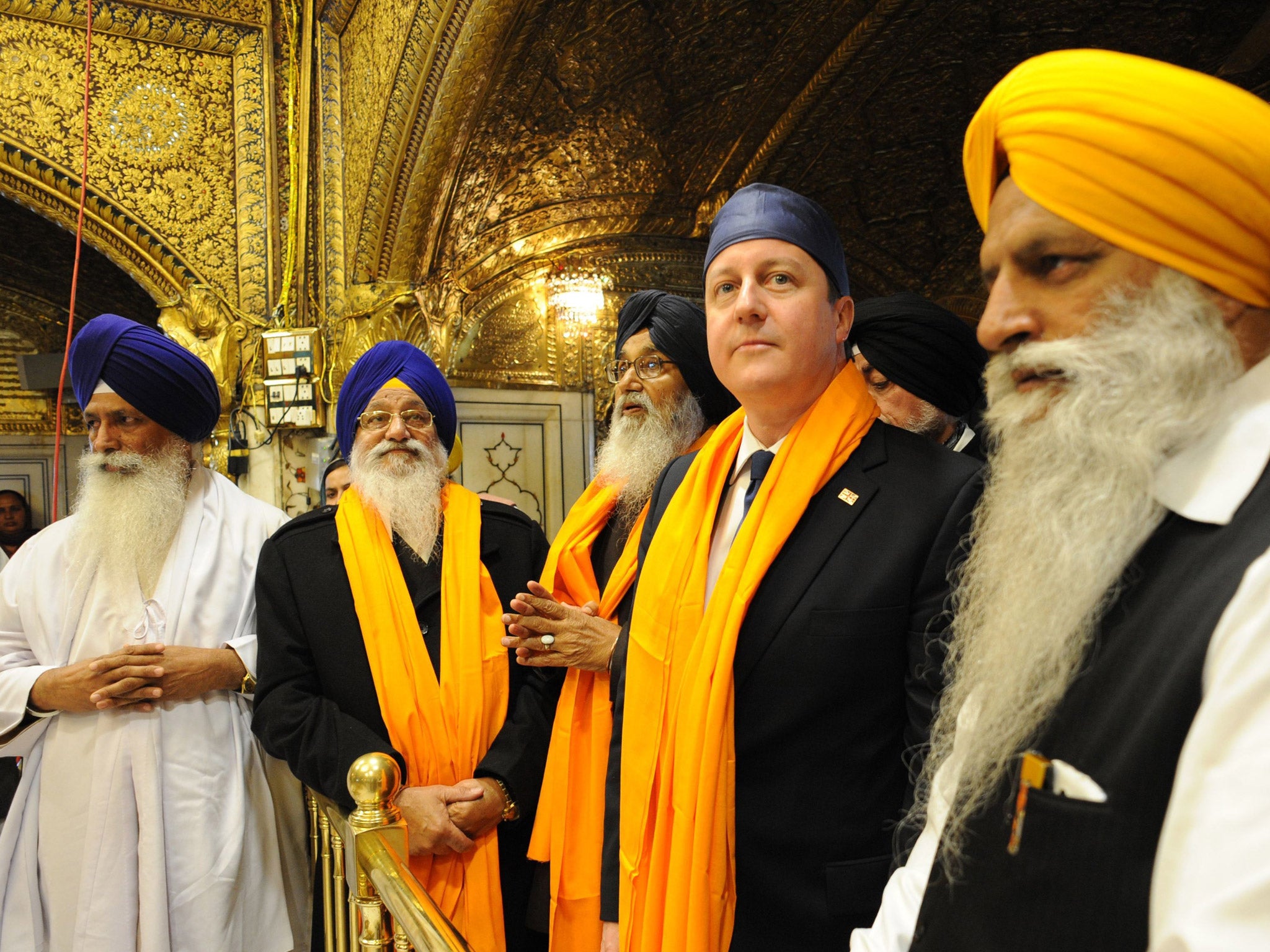 Prime Minister David Cameron is shown around the Golden Temple