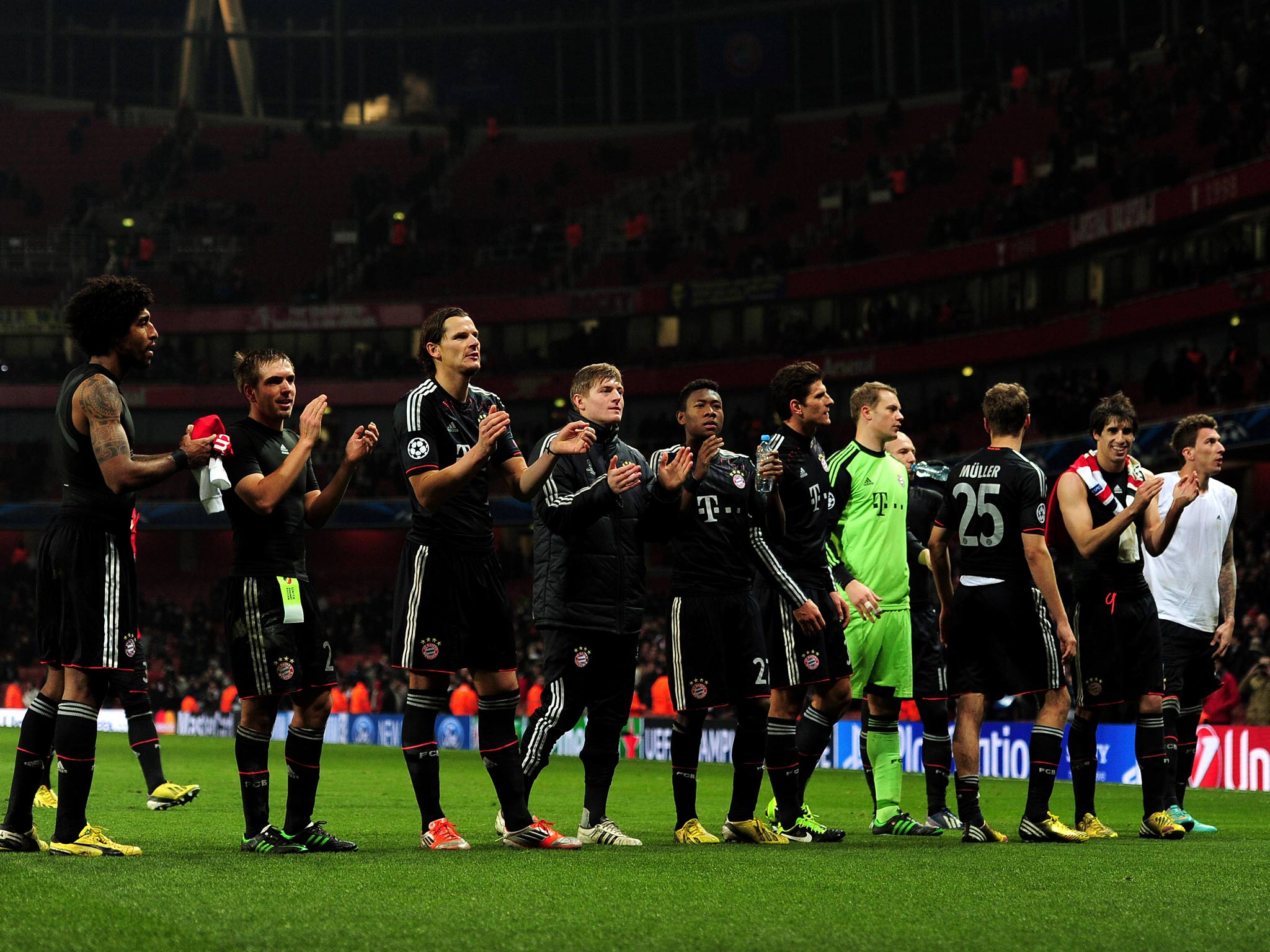 The Bayern Munich team acknowledge their fans after the victory over Arsenal