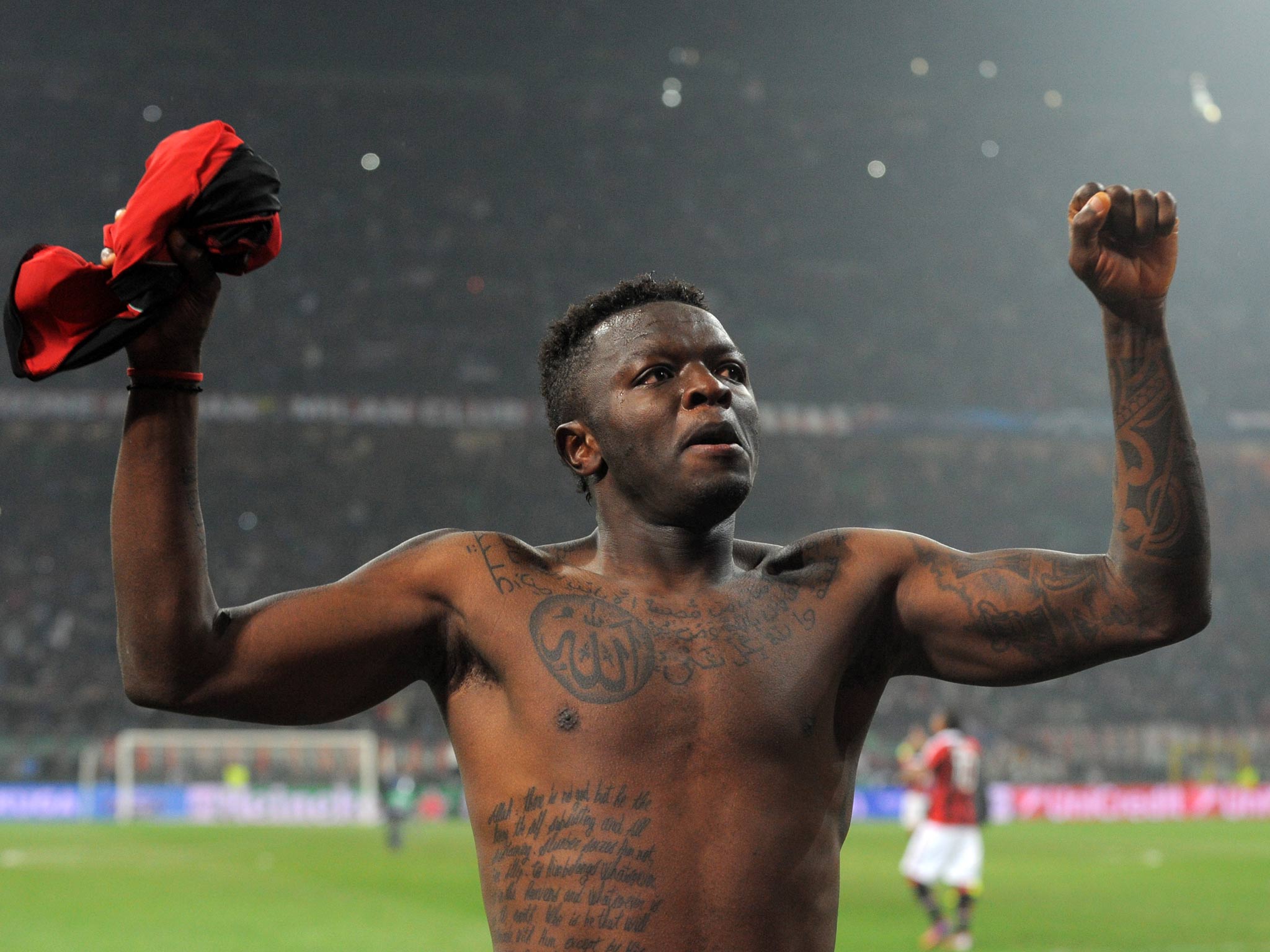 Sulley Ali Muntari celebrates at the end of the Champions League clash between AC Milan and Barcelona