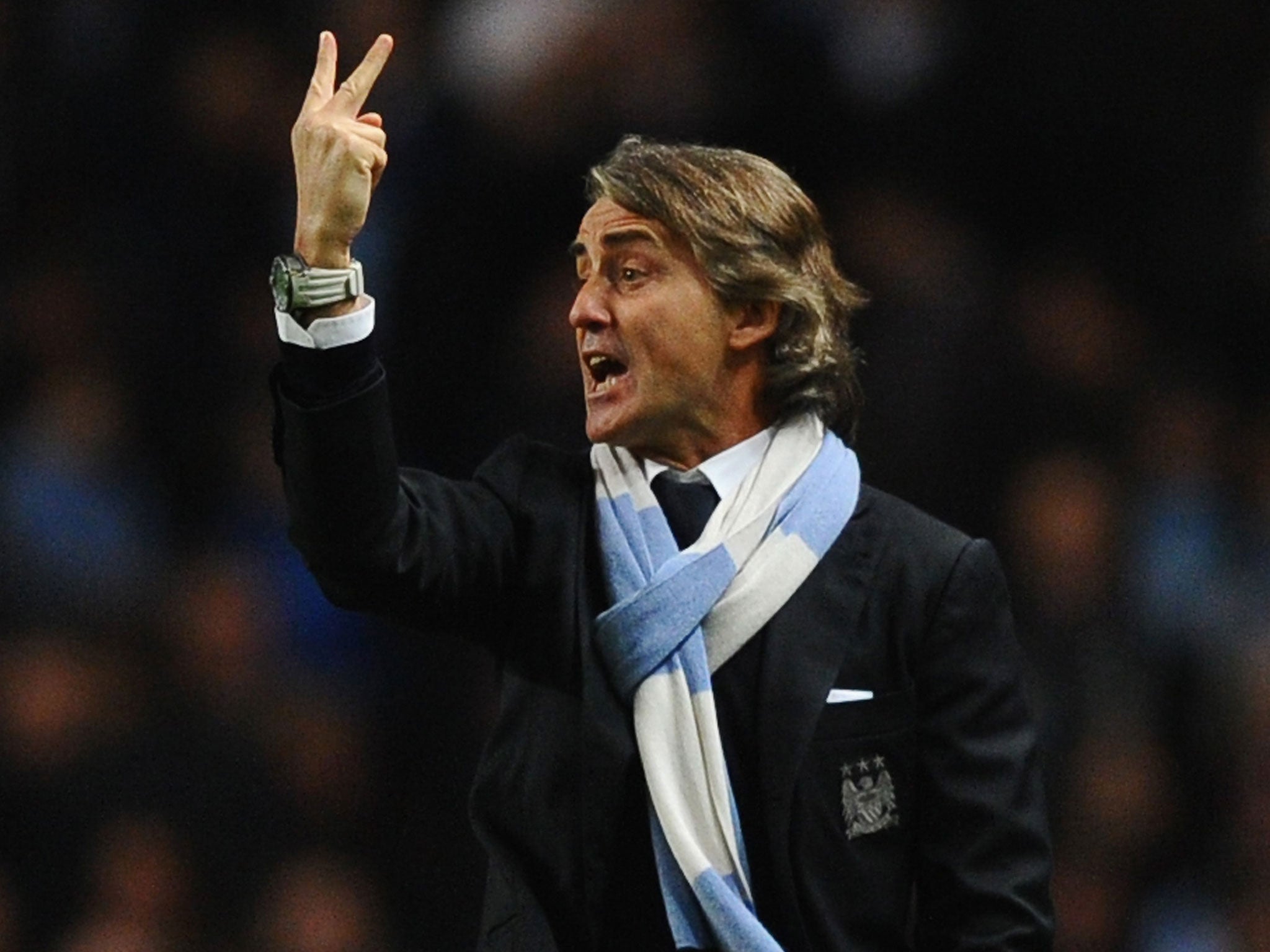 Manchester City Manager Roberto Mancini reacts during the Barclays Premier League match between Manchester City and Liverpool