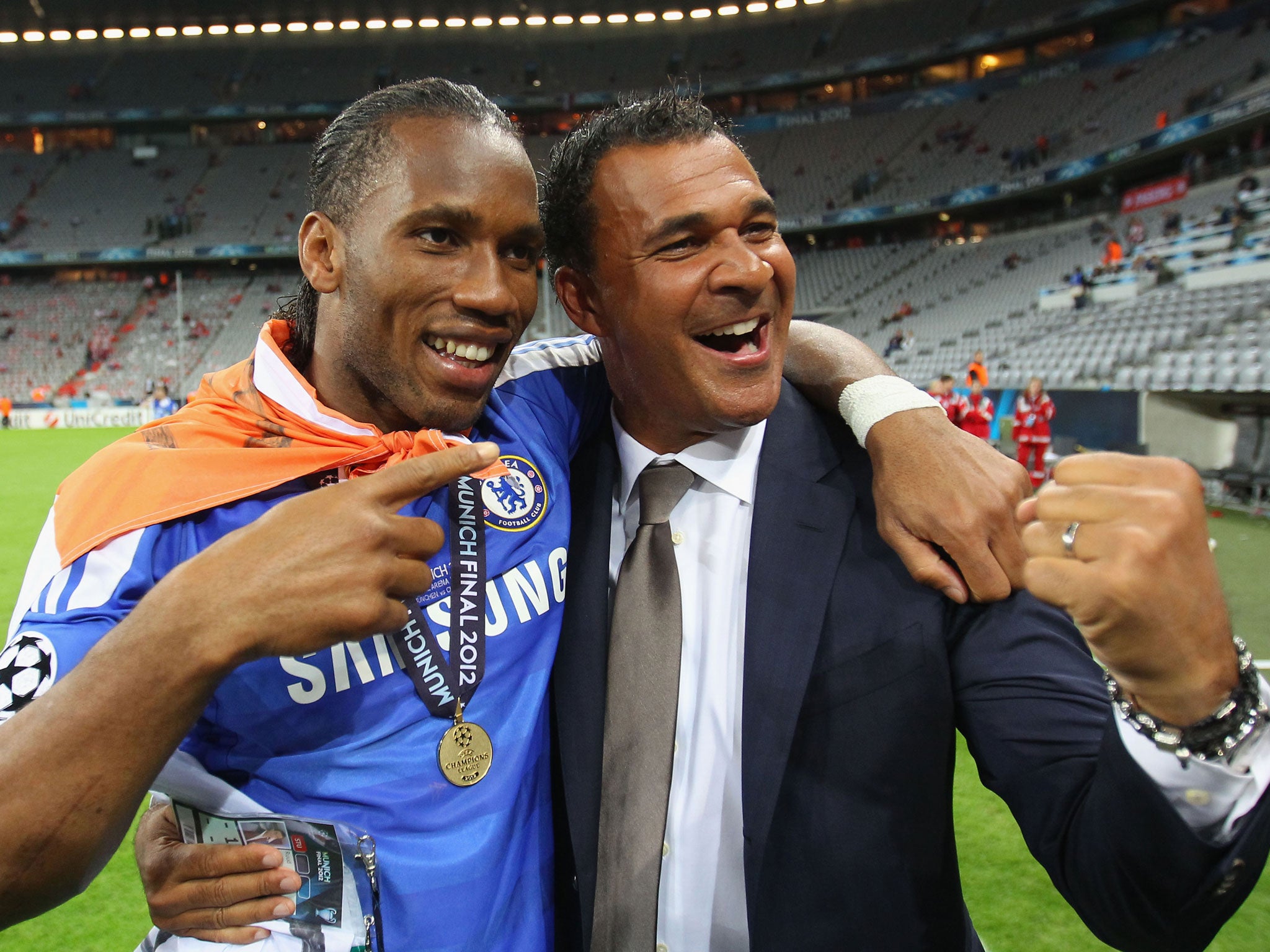 Didier Drogba of Chelsea and former Chelsea manager Ruud Gullit celebrate after their victory in the UEFA Champions League Final