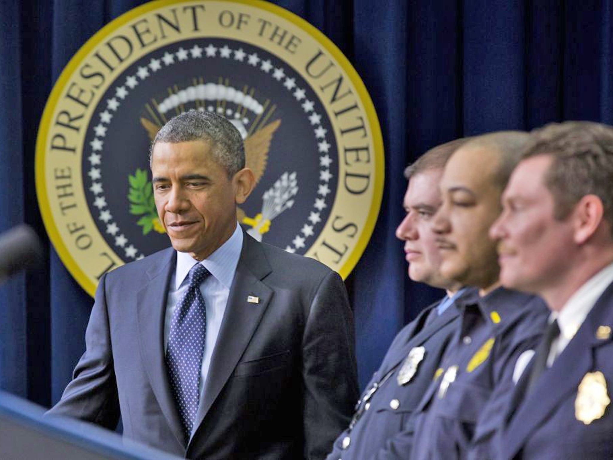 Barack Obama with emergency responders urges Congressional action to stop spending cuts
