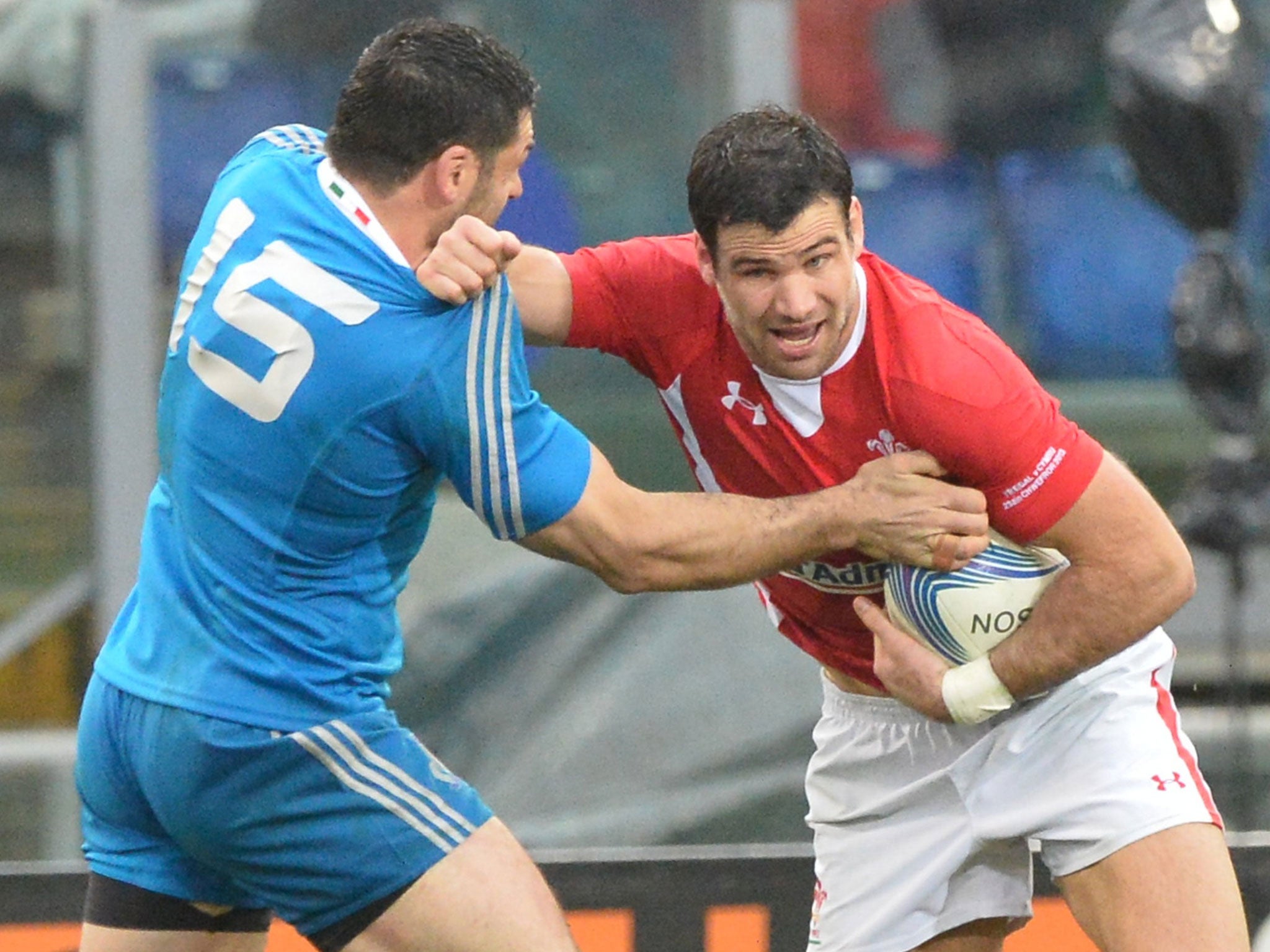 Wales' Mike Phillips tussles with an Italian player