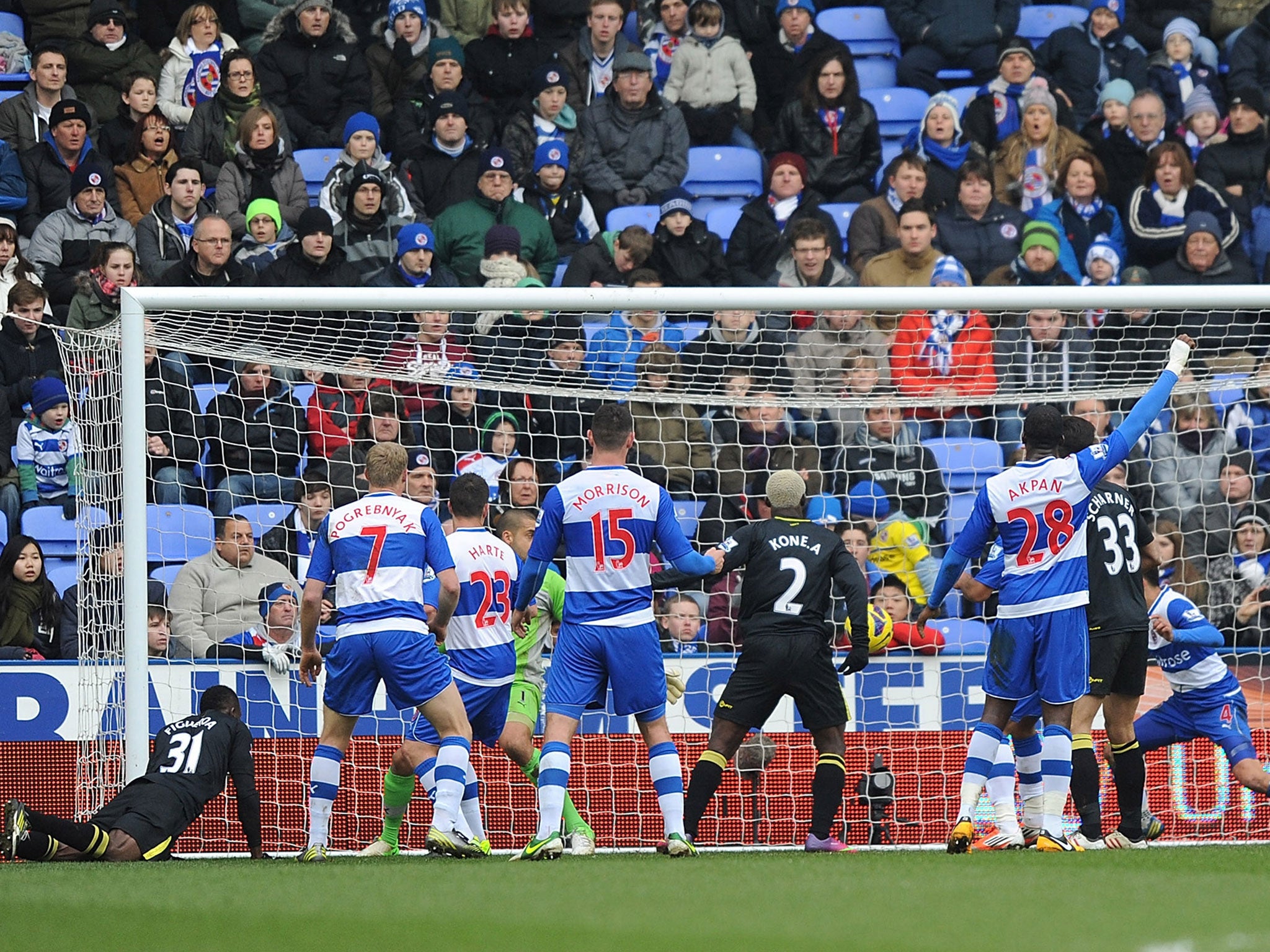 Reading watch as Wigan's Kone slots his goal home