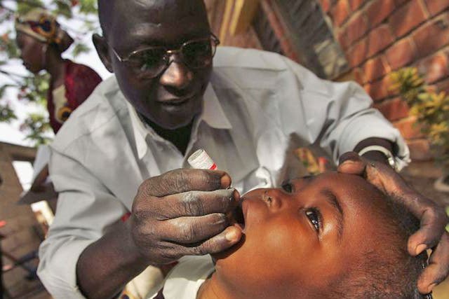 A child receives polio vaccine in Kano, Nigeria