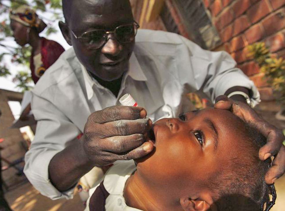 A child receives polio vaccine in Kano, Nigeria