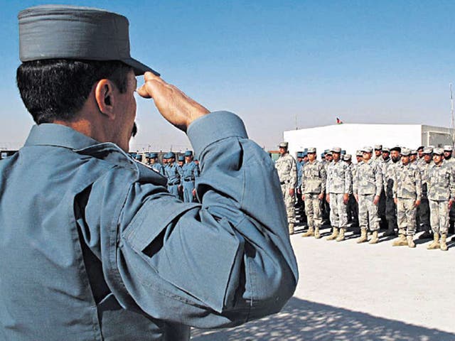 Newly trained Afghan police at their graduation ceremony in Helmand earlier this month