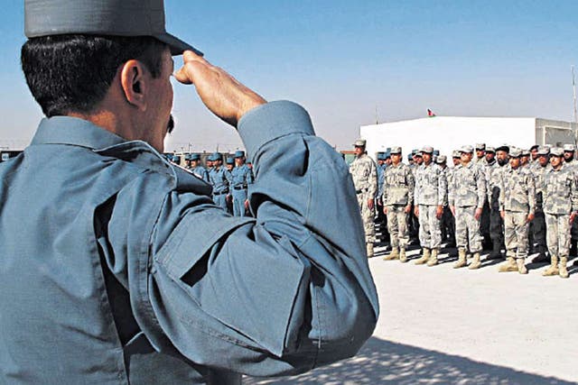 Newly trained Afghan police at their graduation ceremony in Helmand earlier this month