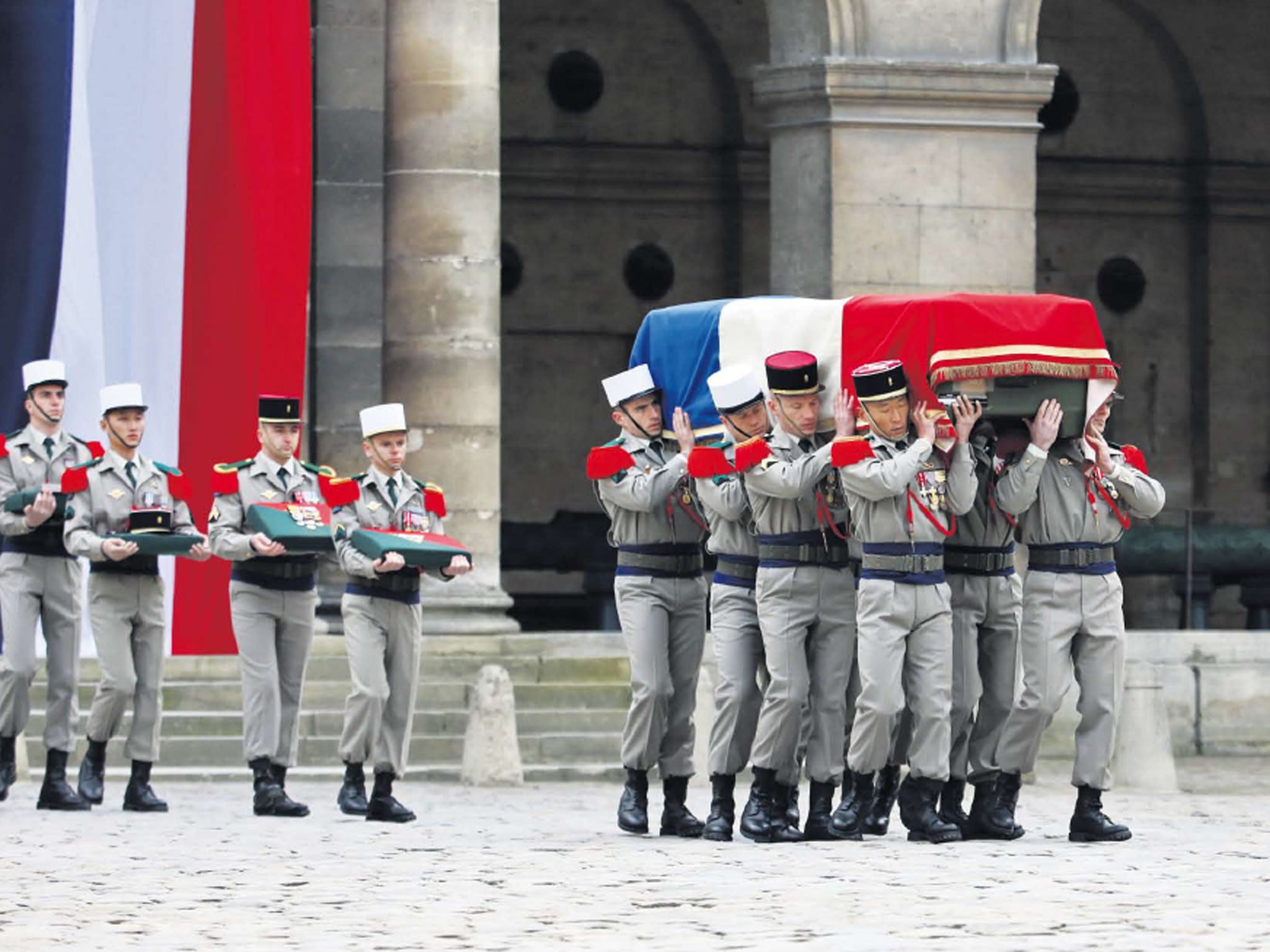 Endless war: French troops carry the coffin on Friday of a soldier killed in Mali