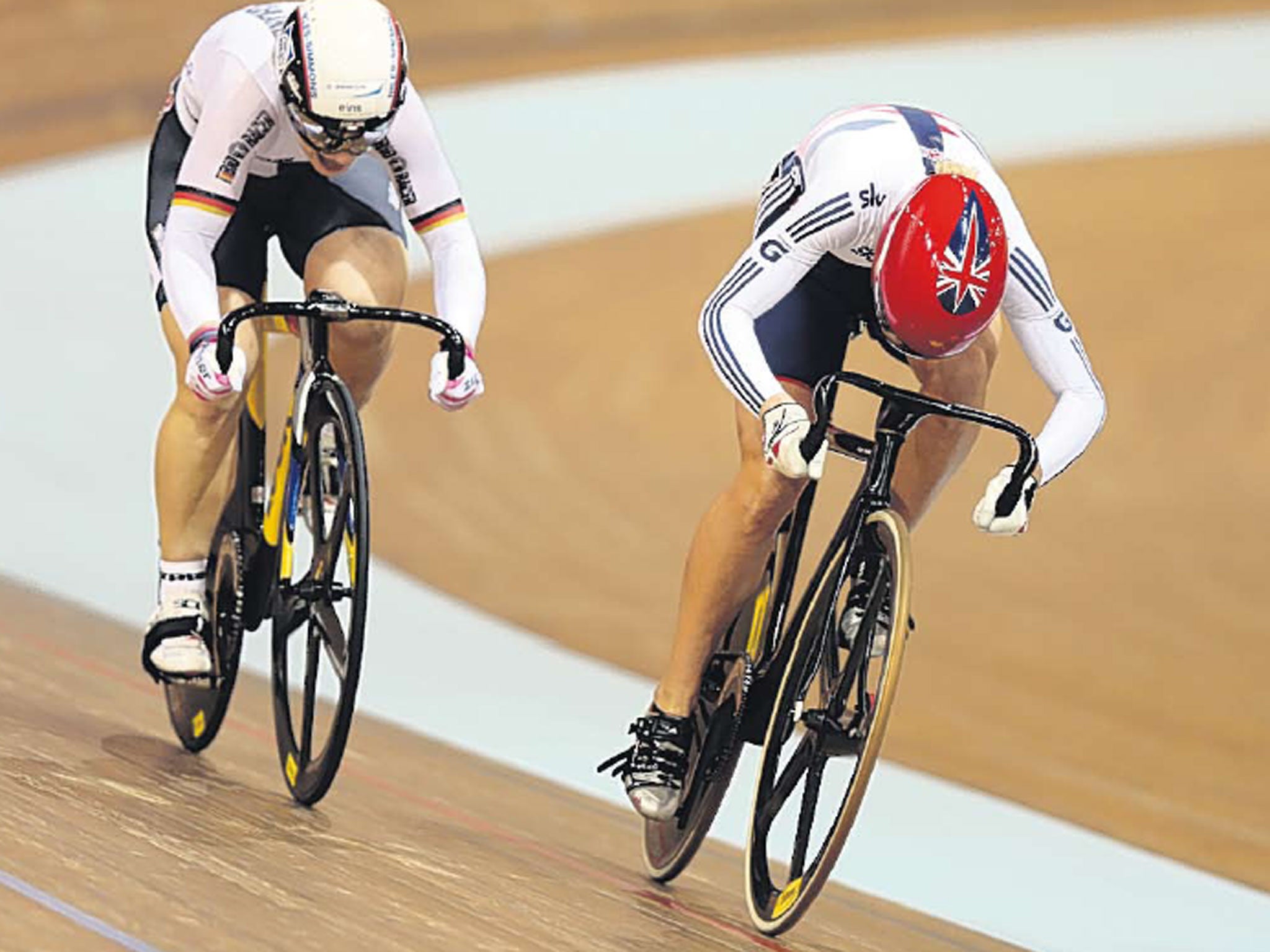 Pedal to the medal: Britain’s Becky James leads Kristina Vogel of Germany in the deciding race to win the sprint gold