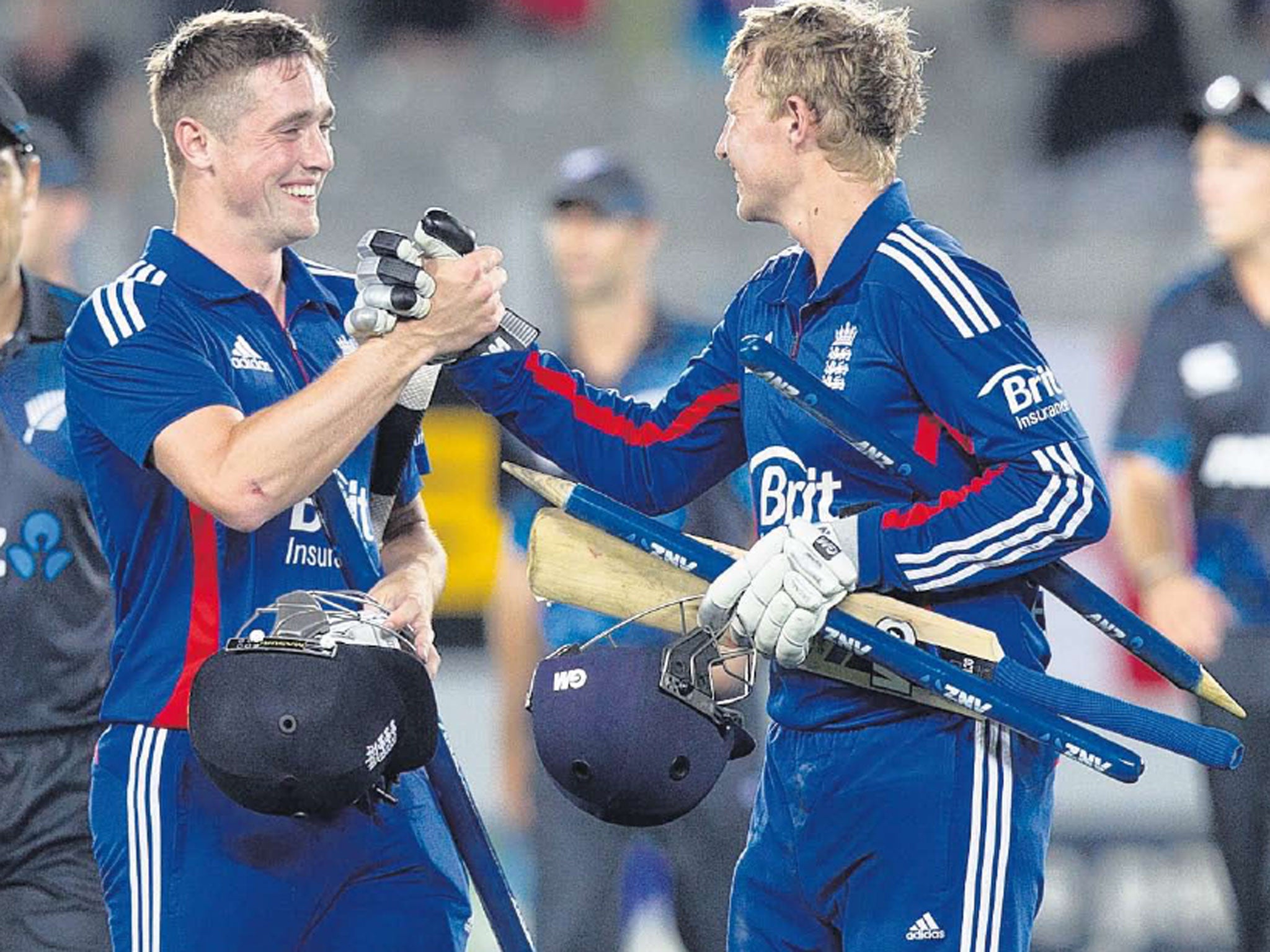 Root to success: Chris Woakes and Joe Root celebrate seeing England home