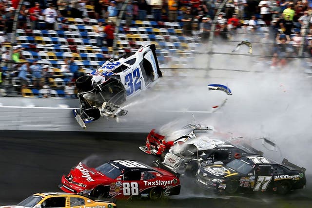 The victims were sprayed with large chunks of debris - including a tyre - after newcomer Kyle Larson's machine hit fencing that is designed to protect the massive grandstands lining Nascar's most famous track.