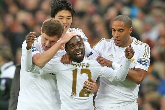 Nathan Dyer of Swansea City celebrates with team mates after scoring the opening goal against Bradford City