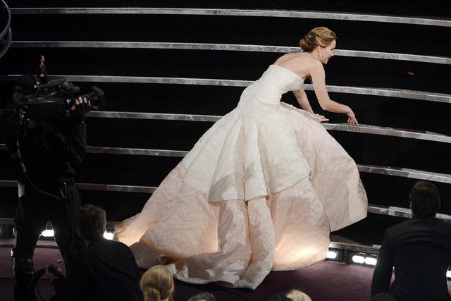 Jennifer Lawrence collapses as she goes up to collect her Best Actress gong at the Oscars