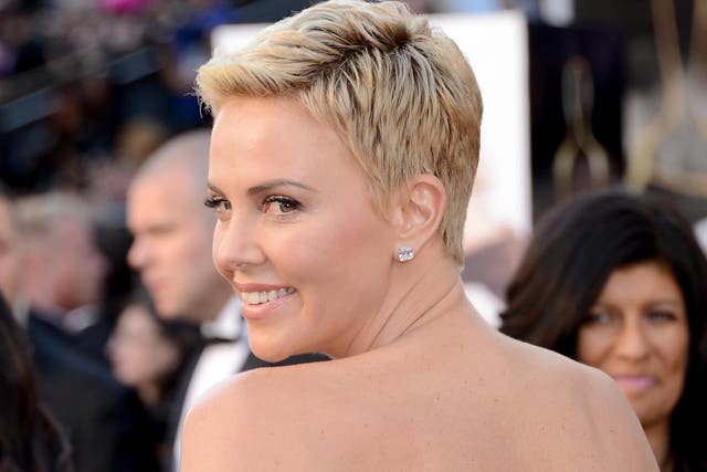 Charlize Theron sports a new cropped hairdo at the Oscars