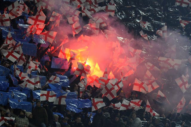 Inter fans wave flags and set off flares at the San Siro