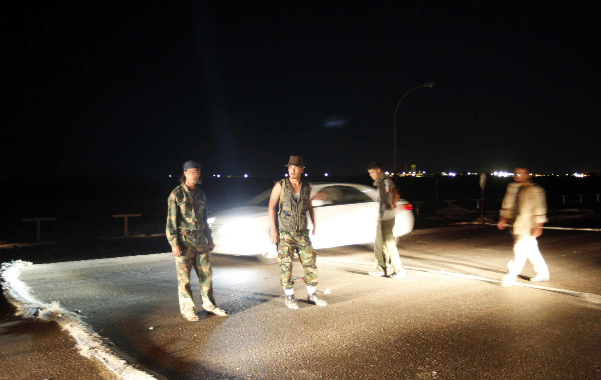 Armed Libyans claiming to be federalist supporters set up a checkpoint outside Sidra oil terminal in 2012