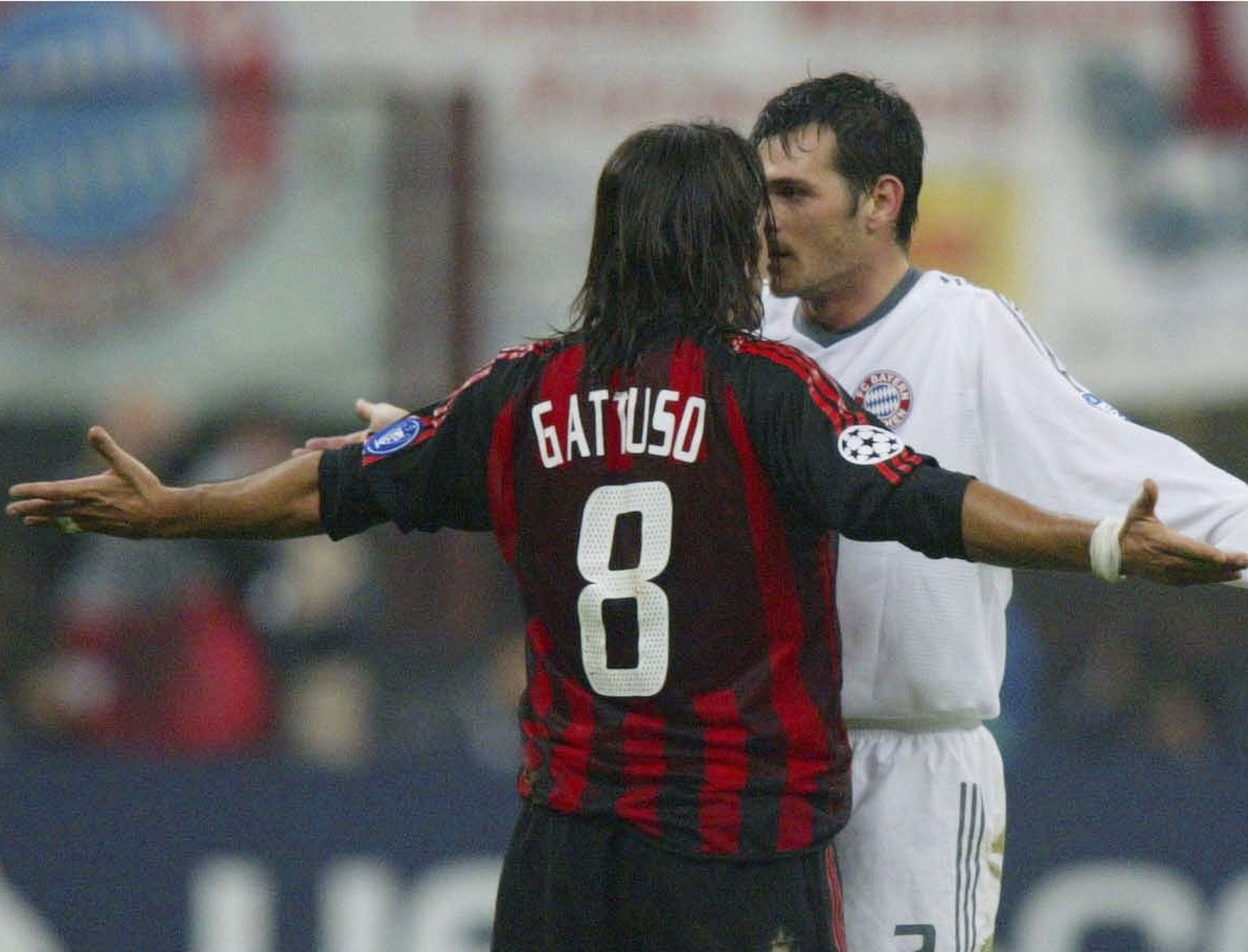 FC Sion's new manager Gennaro Gattuso squres up with Bayern Munich's Willy Sagnol in 2002