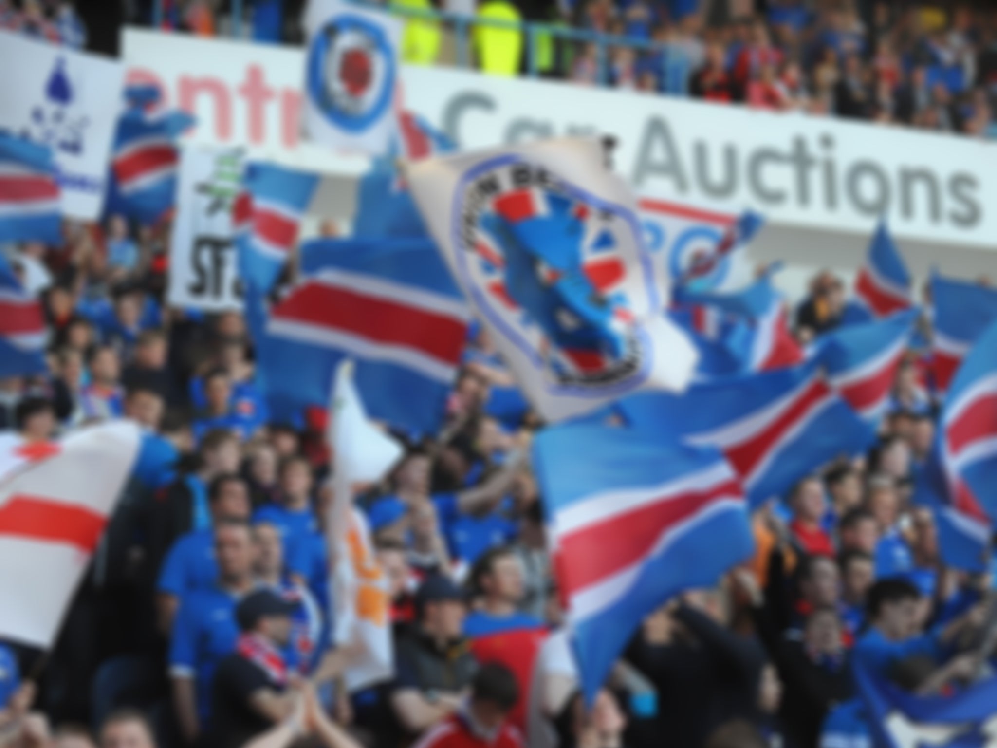 Rangers fans wave their characteristic flags